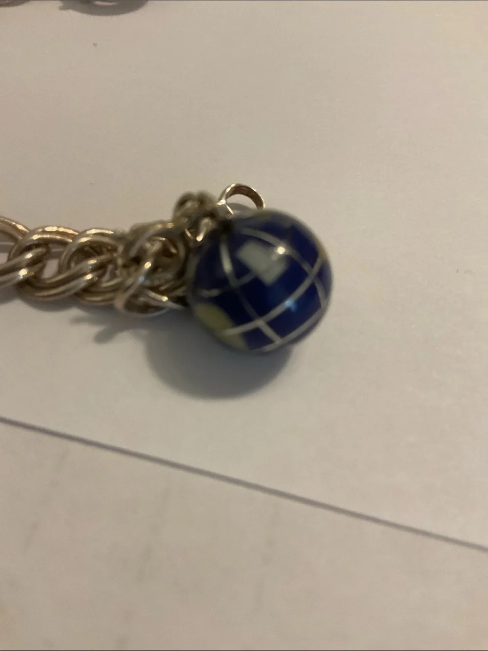 Sterling silver charm bracelet with world charm
